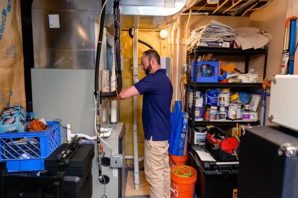 Air Temp tech performing a furnace repair